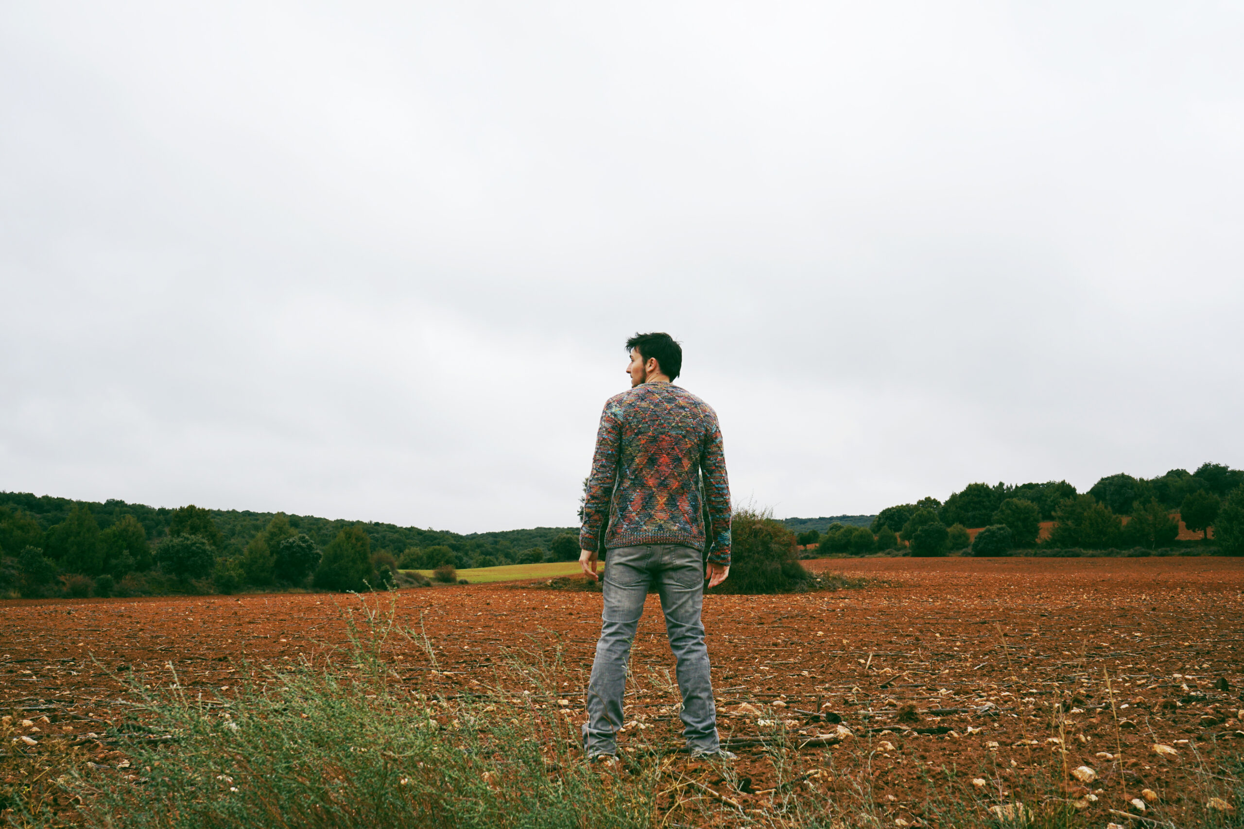Young man alone and sad in nature
